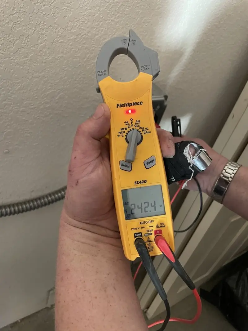 Voltage testing with clamp meter during Aluminum Wiring Replacement in Eagle Grove